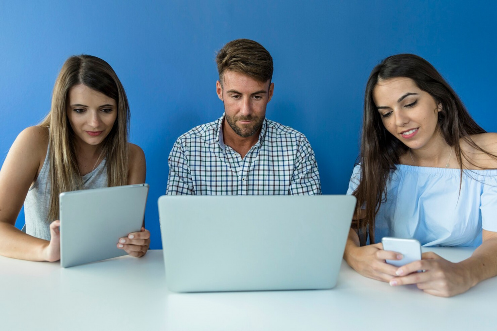 young-friends-working-with-devices_23-2147859190.jpg